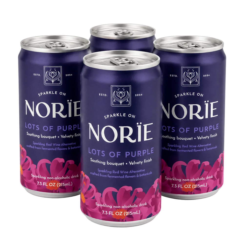 Four 7.3 fl oz cans of Norïe Lots of Purple sparkling non-alcoholic drink arranged in a 2x2 cluster