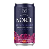 A 7.3 fl oz can of Nori’s 'Lots of Purple' sparkling non-alcoholic drink, featuring a deep navy blue label with purple floral graphics and white text, set against a plain white background.