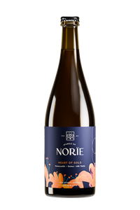 Bottle of Norïe Heart of Gold non-alcoholic sparkling drink with orange flower illustration on the label