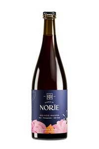 Bottle of Norïe Red Rose Whisper non-alcoholic sparkling drink with pink flower illustration on the label